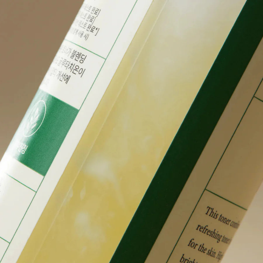 Image showing the texture of the Axis-Y Dark Spot Correcting Glow Toner inside the bottle. The two layers of the toner are shown separating.