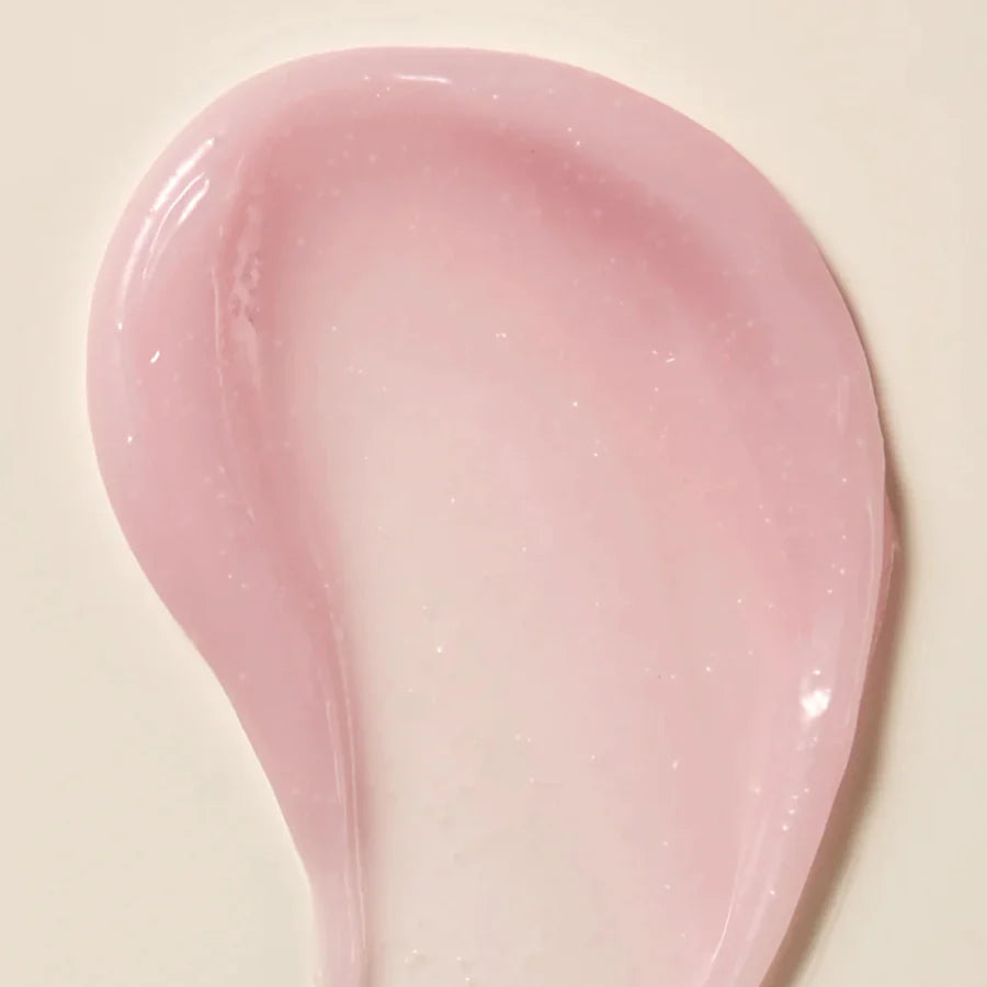 Axis-Y Calamine Pore Control apsule Serum texture reference. The serum is of a light pink gel consistency with tiny capsules in it.